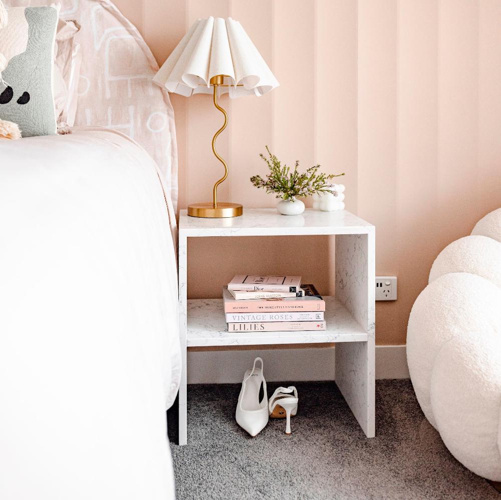 Orlando Side Table style in Pink Room with white high heel shoes and various books with Pablo and Joy Lamp
