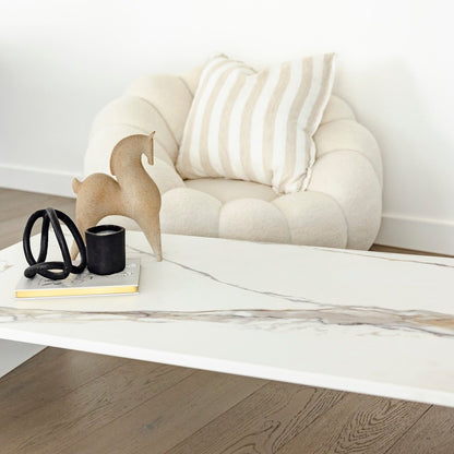 Matteo Coffee Table with styled top and white boucle swivel chair 